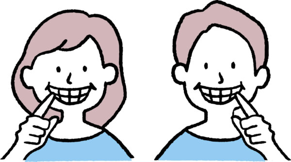 白い歯を見せる男女