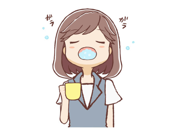 歯磨き後うがいをする女性