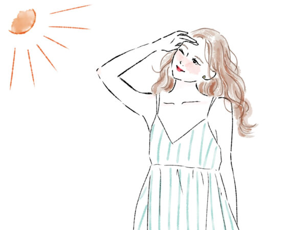 眩しそうに太陽を見る女性